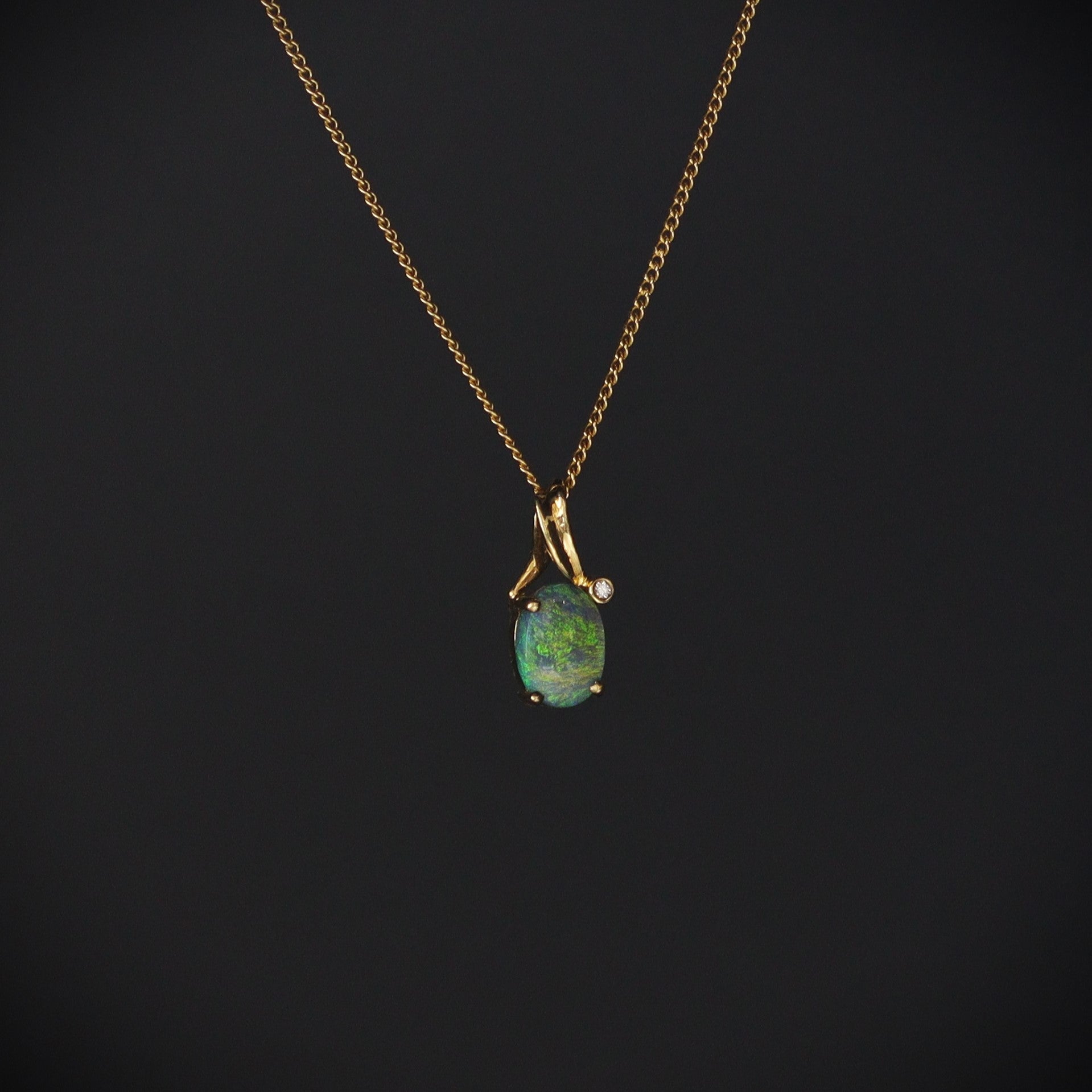 Australian Black Opal 18kt gold pendant 