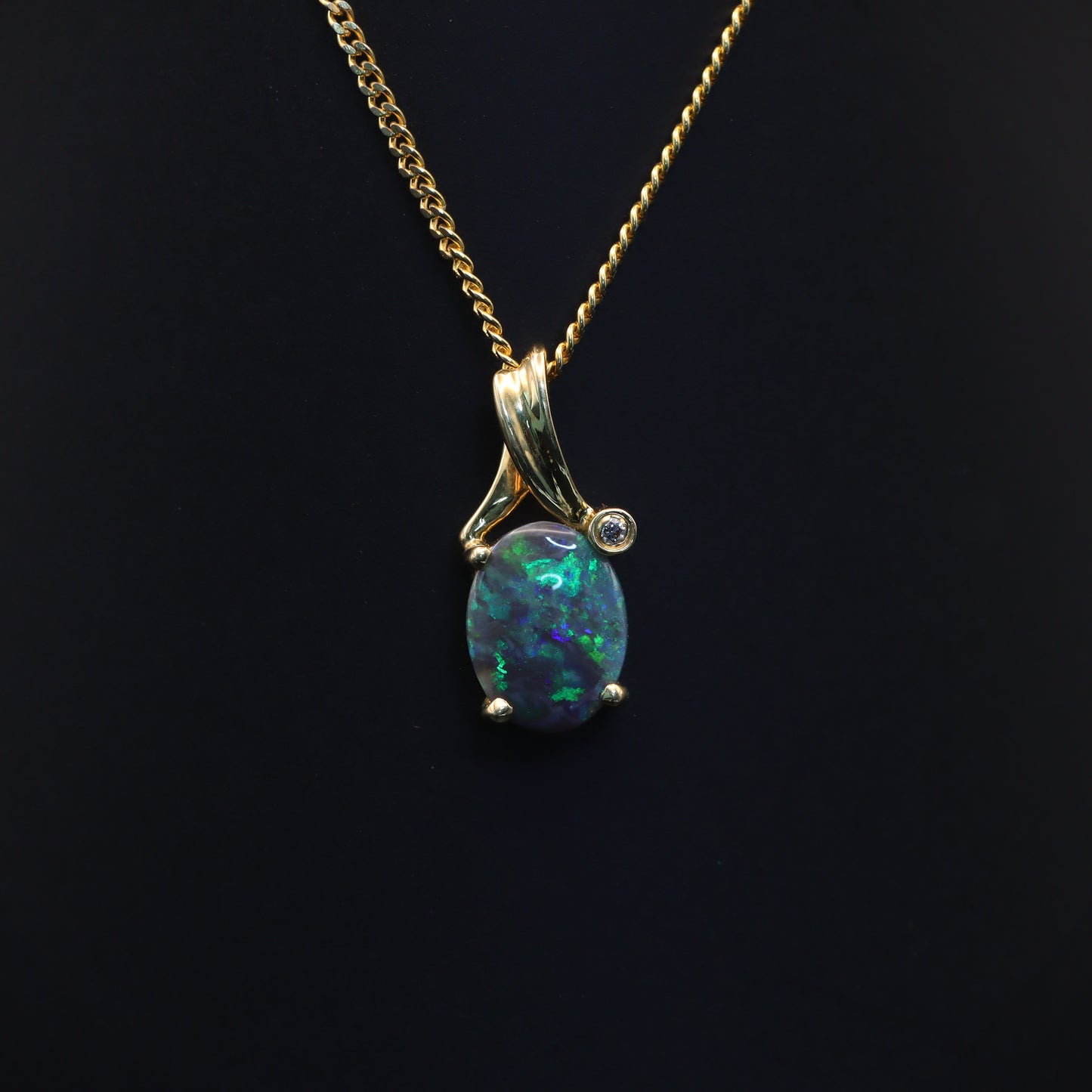 Australian Black solid Opal  in 18 karat gold pendant 