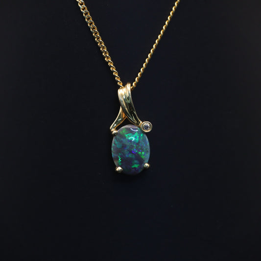 Australian Black solid Opal  in 18 karat gold pendant 