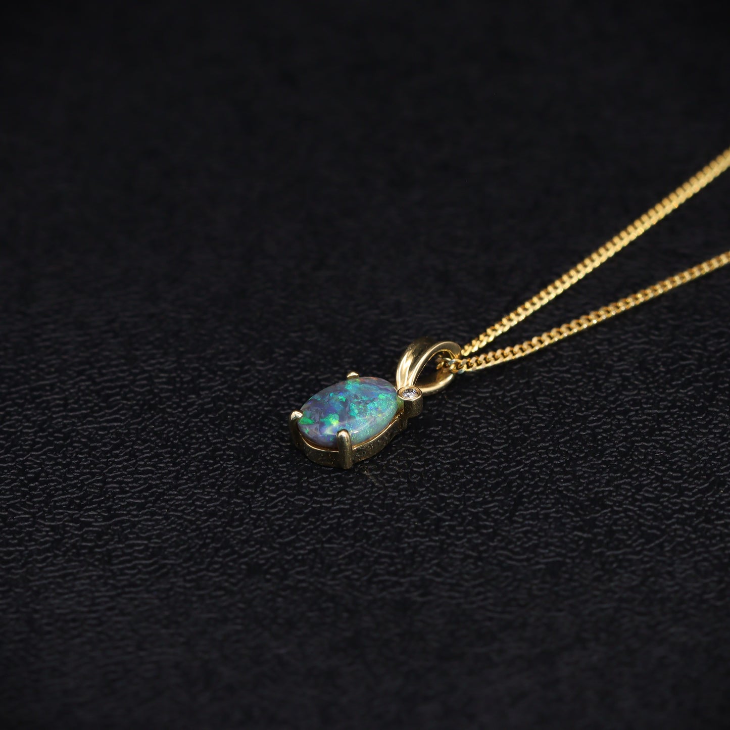 Australian Black solid Opal  in 18 karat gold pendant 