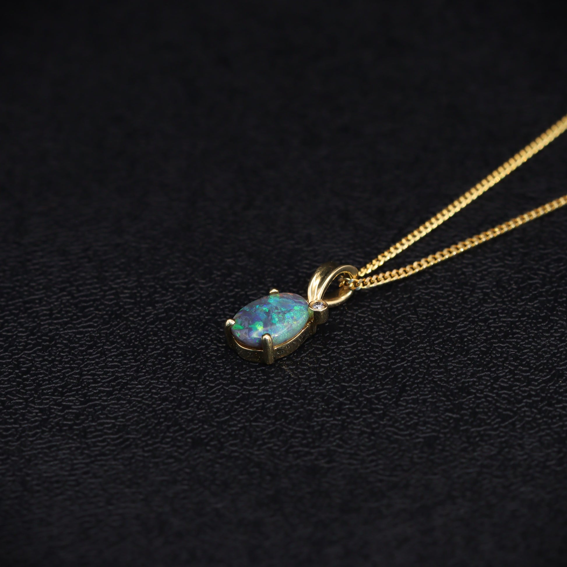 Australian Black solid Opal  in 18 karat gold pendant 