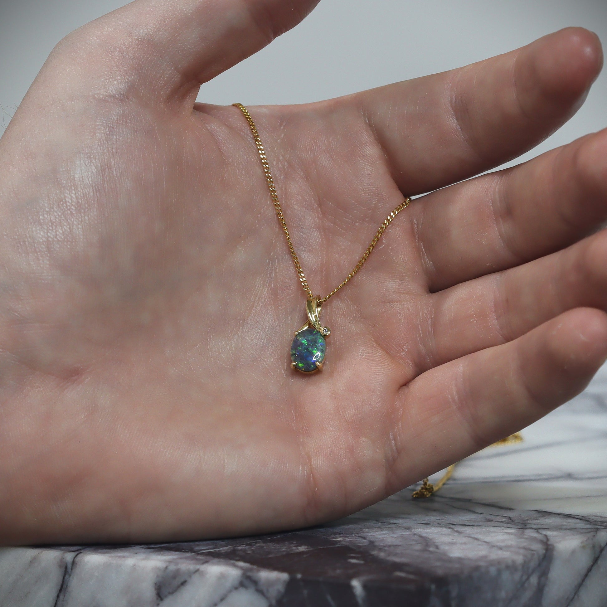 Australian Black solid Opal  in 18 karat gold pendant 