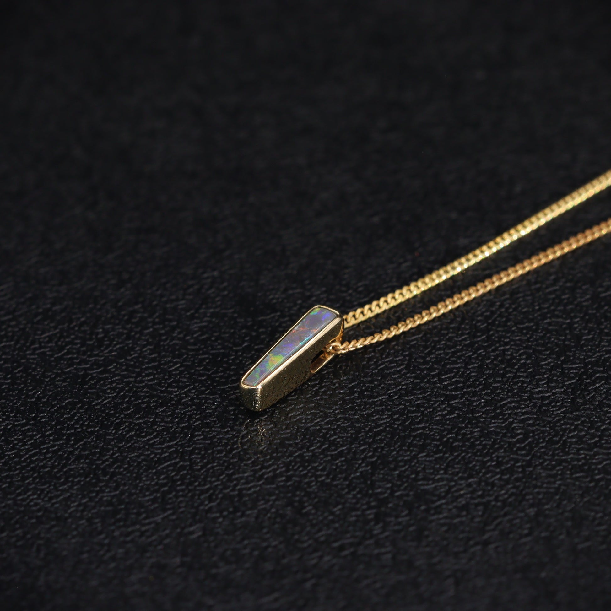 Australian Black solid Opal  in 18 karat gold pendant 