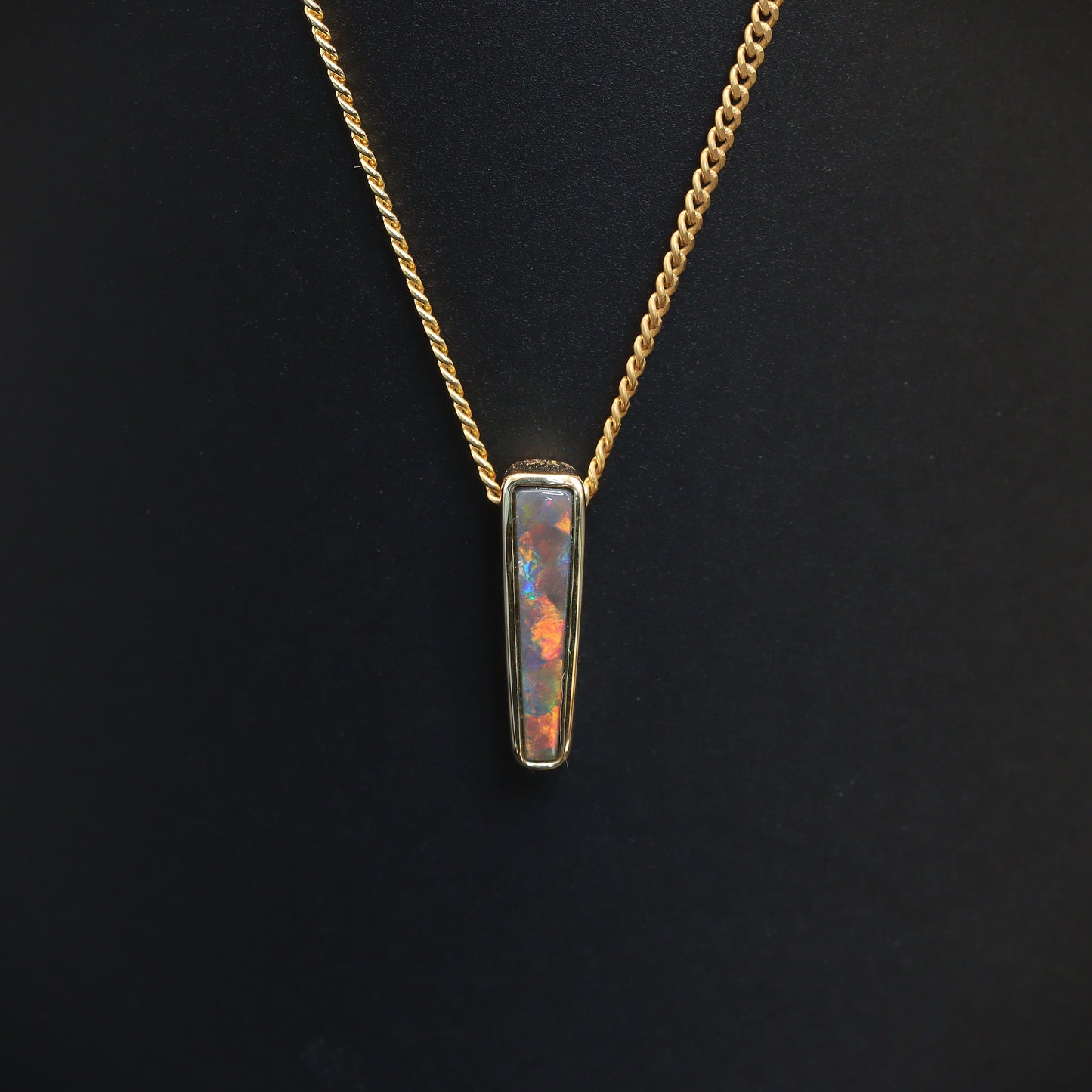 Australian Black solid Opal  in 18 karat gold pendant 