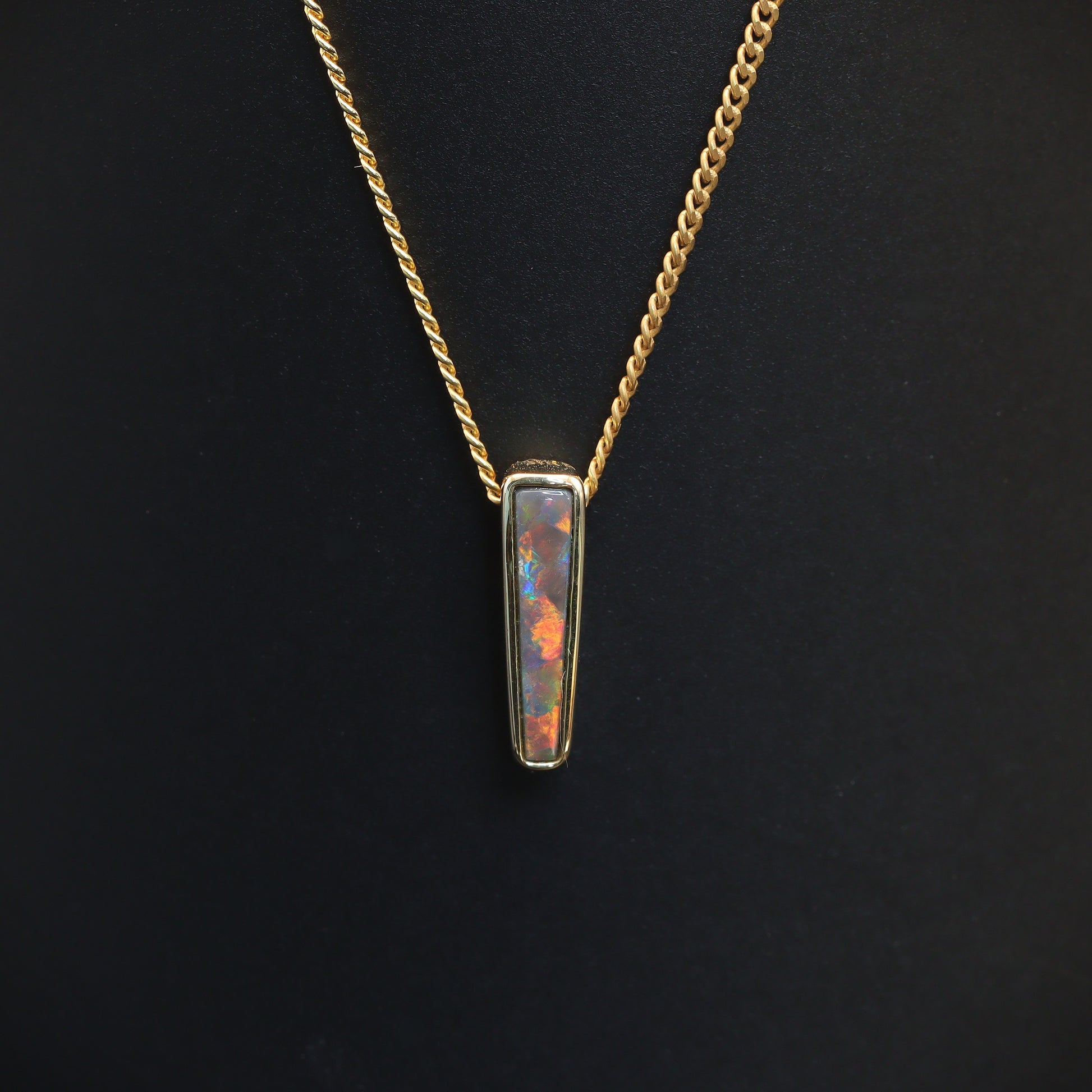 Australian Black solid Opal  in 18 karat gold pendant 