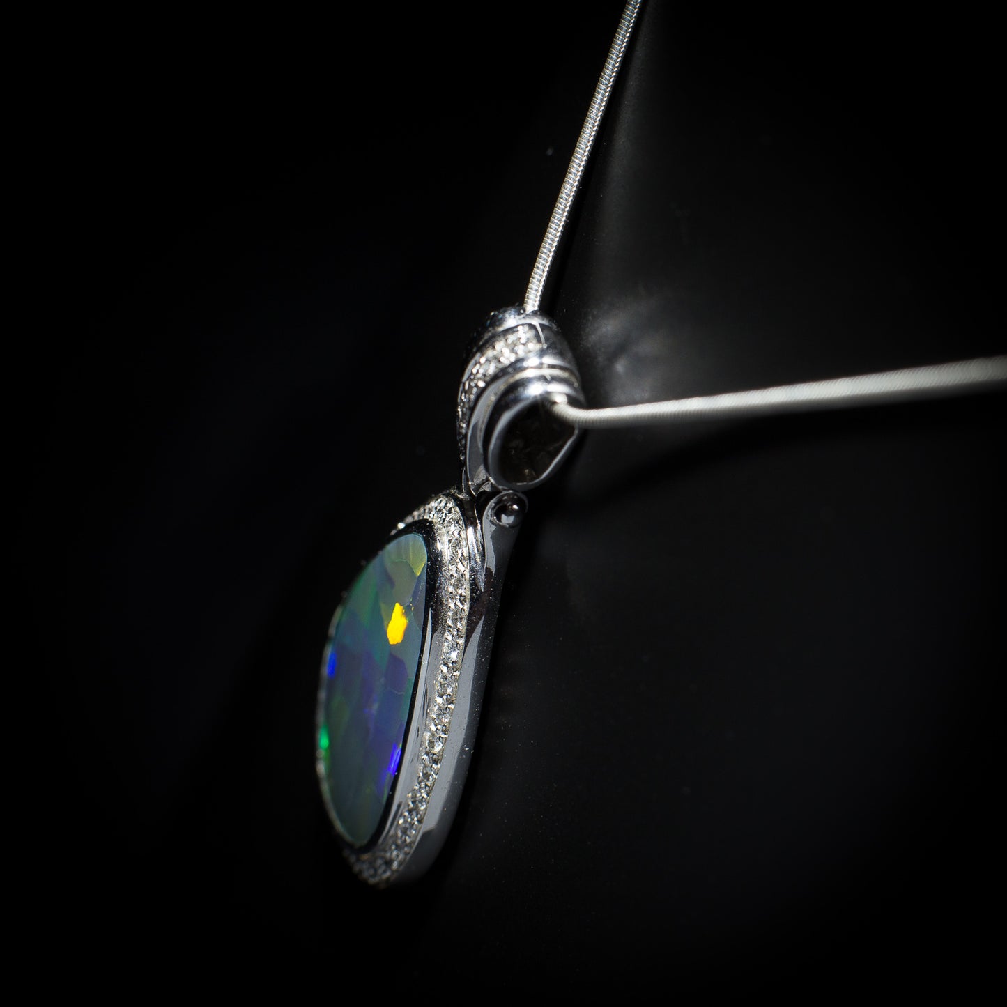 Australian solid Black Opal in 18K WG