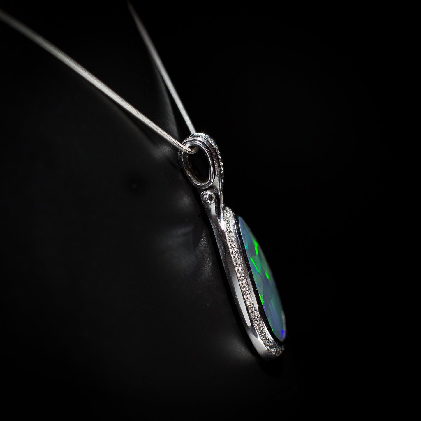 Australian solid Black Opal in 18K WG