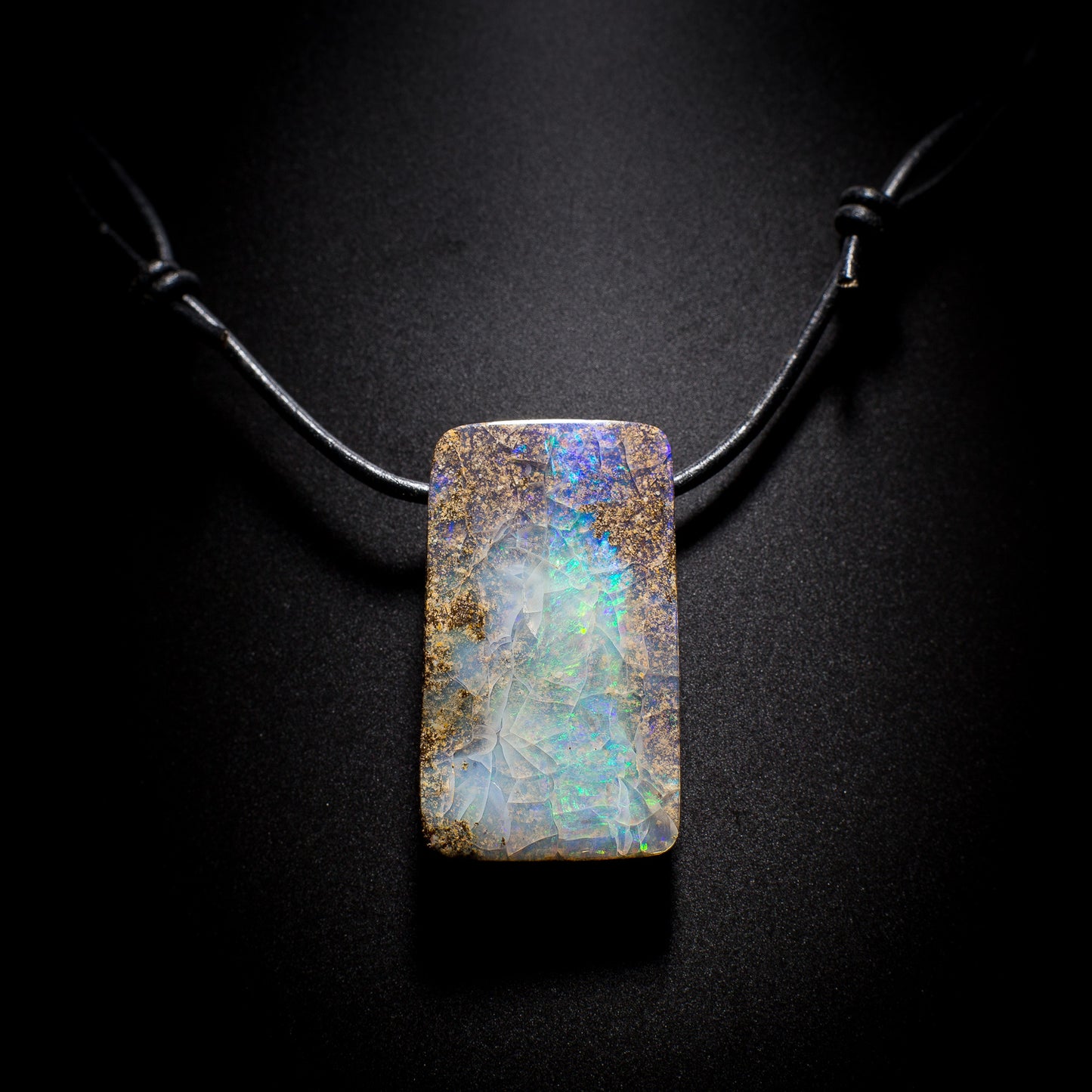 Australian Boulder Opal on leather - 17